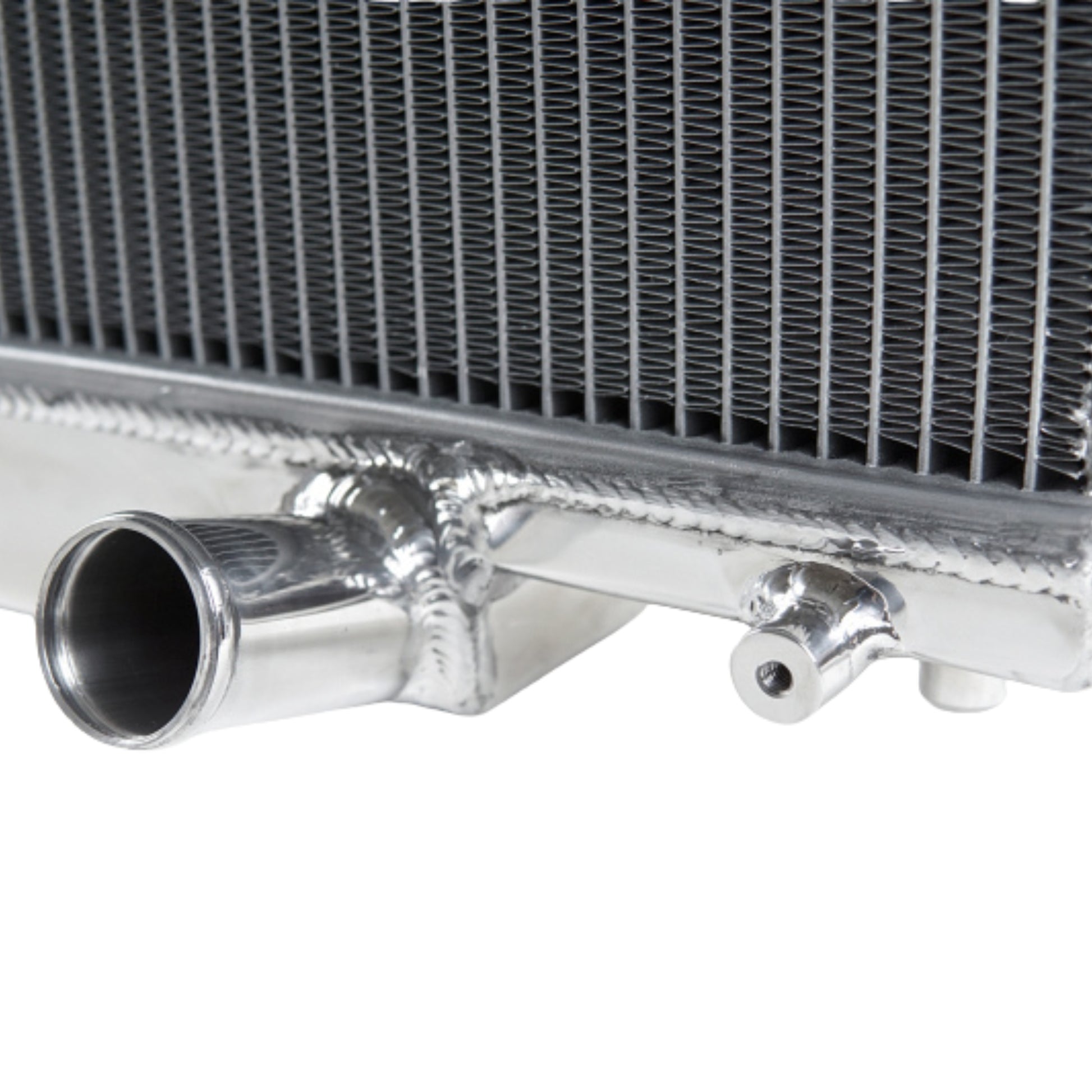 Close-up of a metallic radiator with pipes on a white background