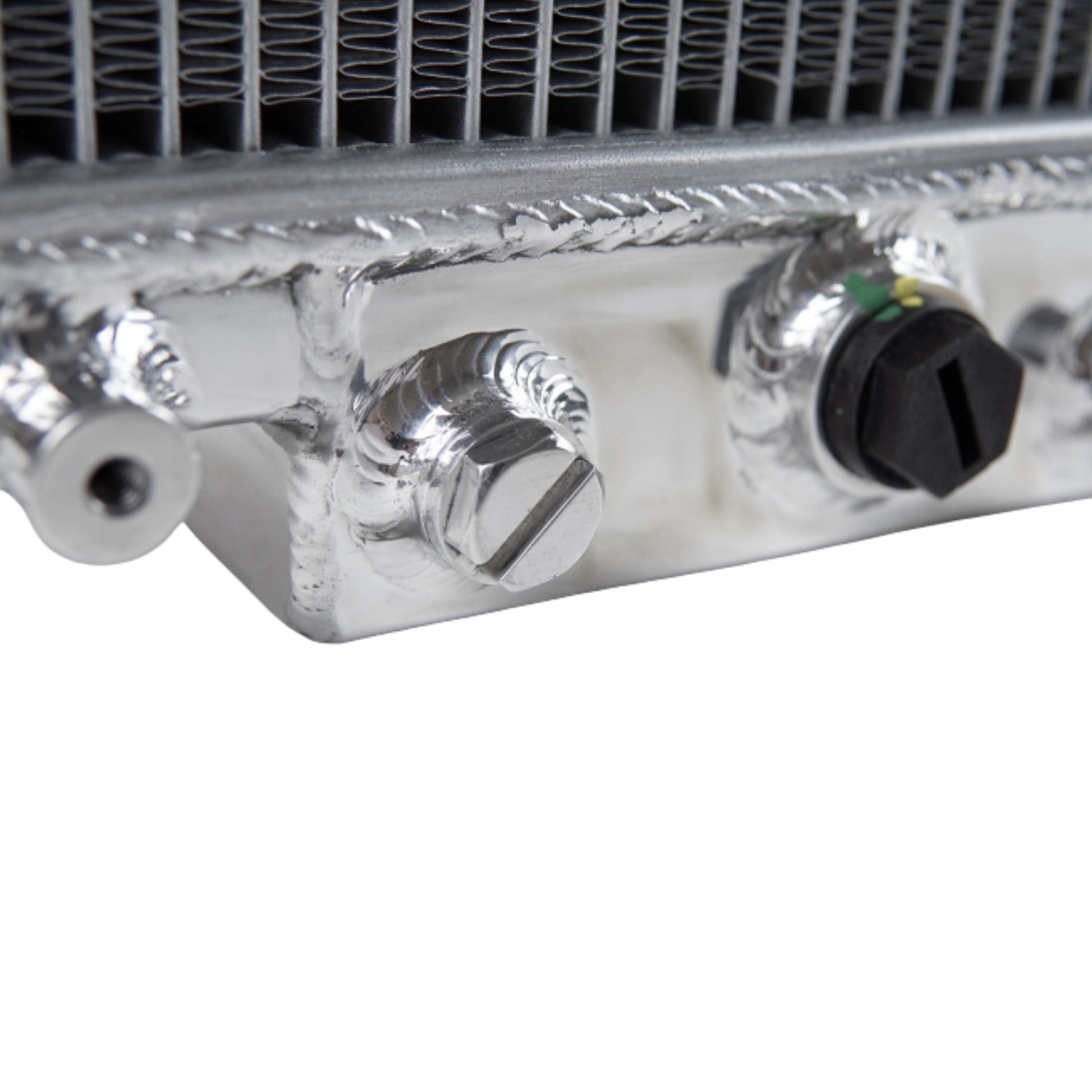 Close-up of a metallic radiator with control knobs on a white background