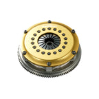 OS Giken Clutch plate with gold and silver components on a white background